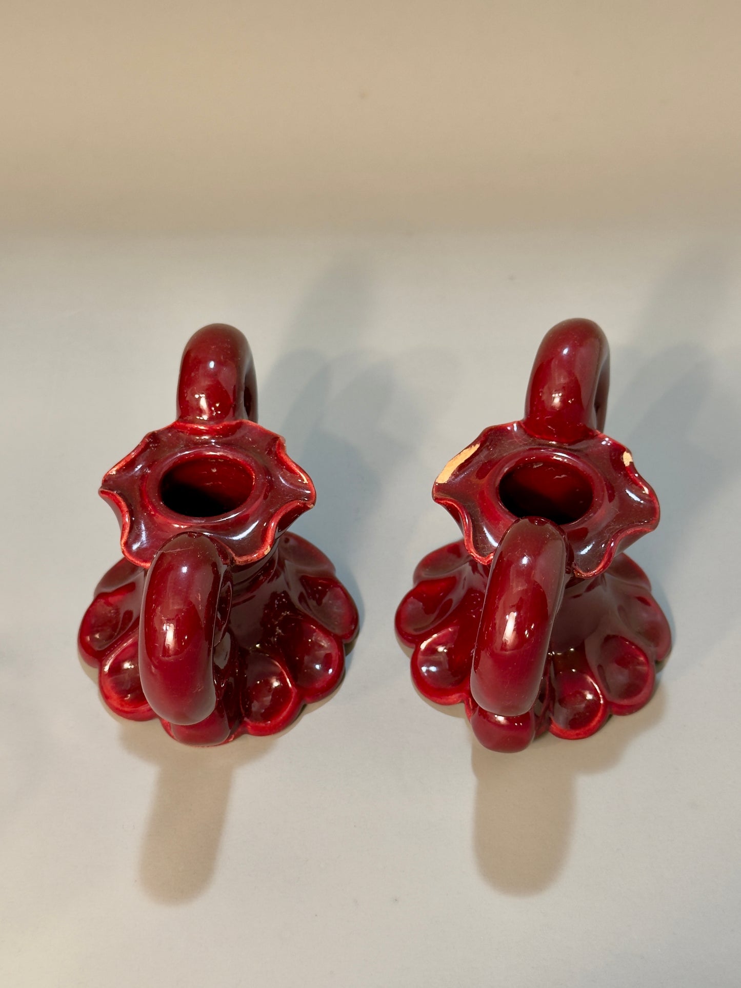 Baroque-style ceramic candle holders – glossy red glaze, vintage