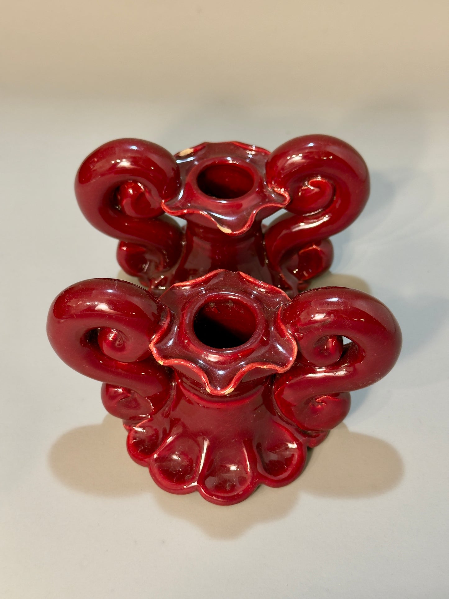 Baroque-style ceramic candle holders – glossy red glaze, vintage