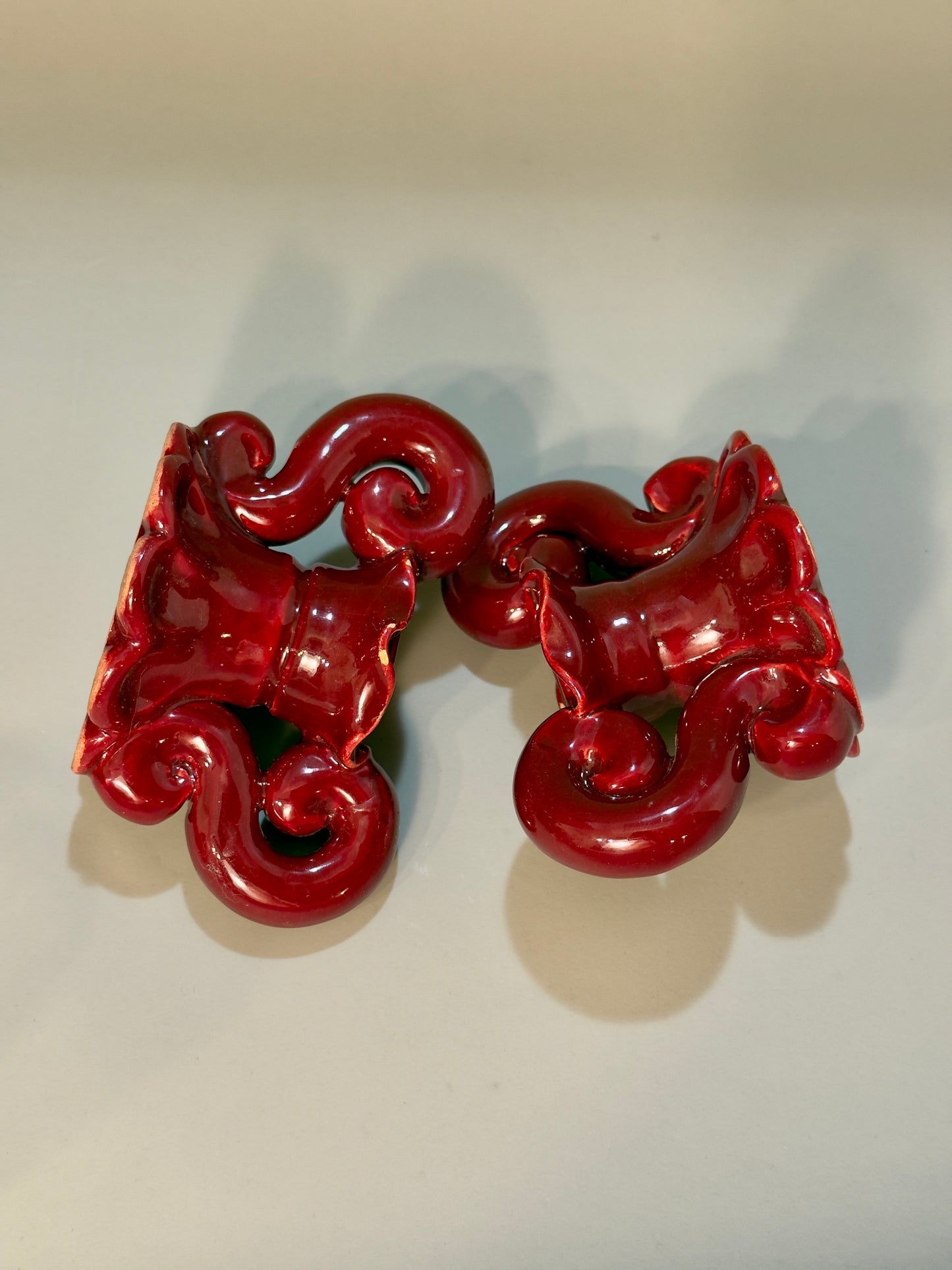 Baroque-style ceramic candle holders – glossy red glaze, vintage