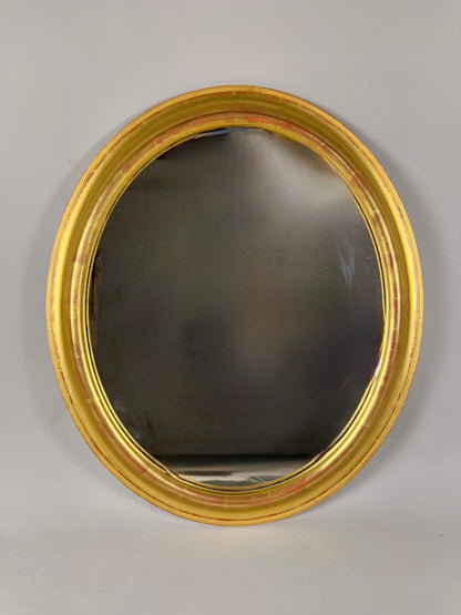 Vintage oval mirror with gold wooden frame