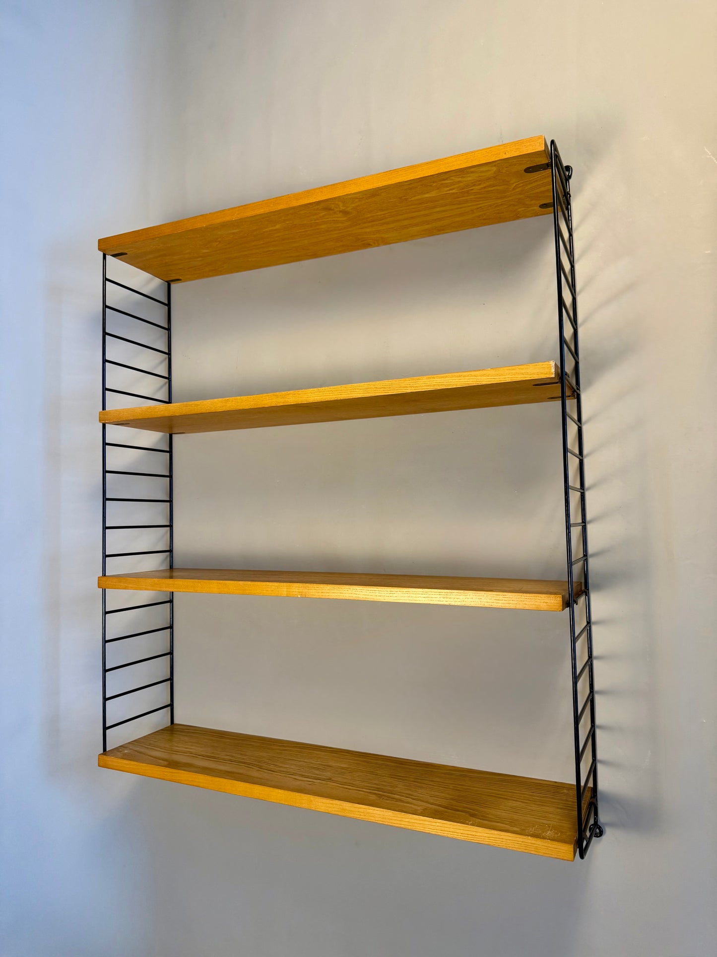 Floating wall shelf in oak veneer and black metal, 1960s