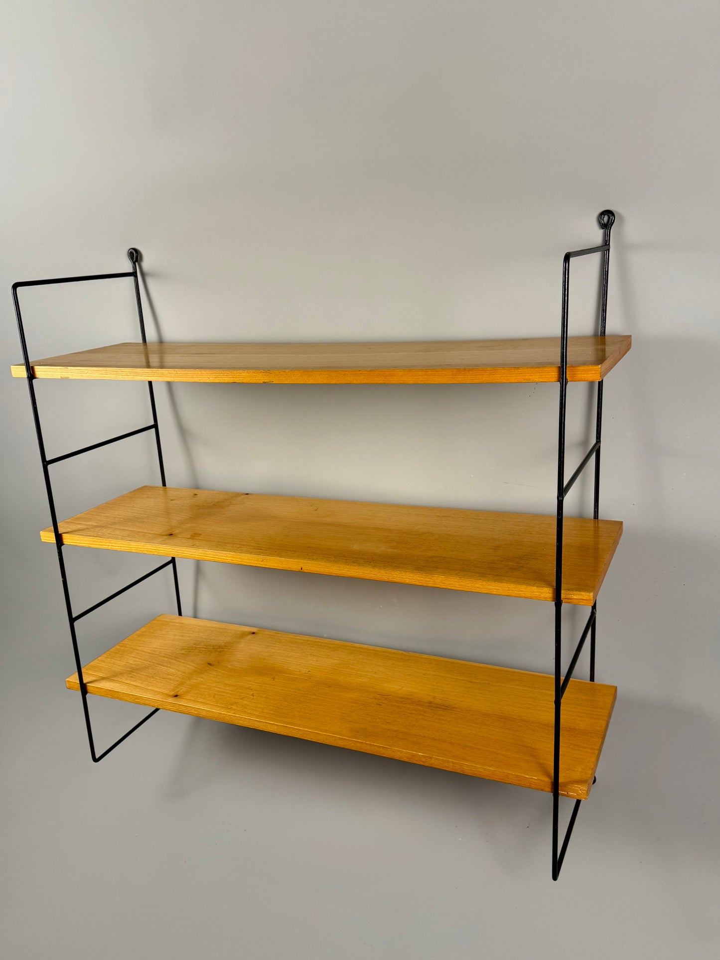 Vintage wall shelf with three wood veneer shelves