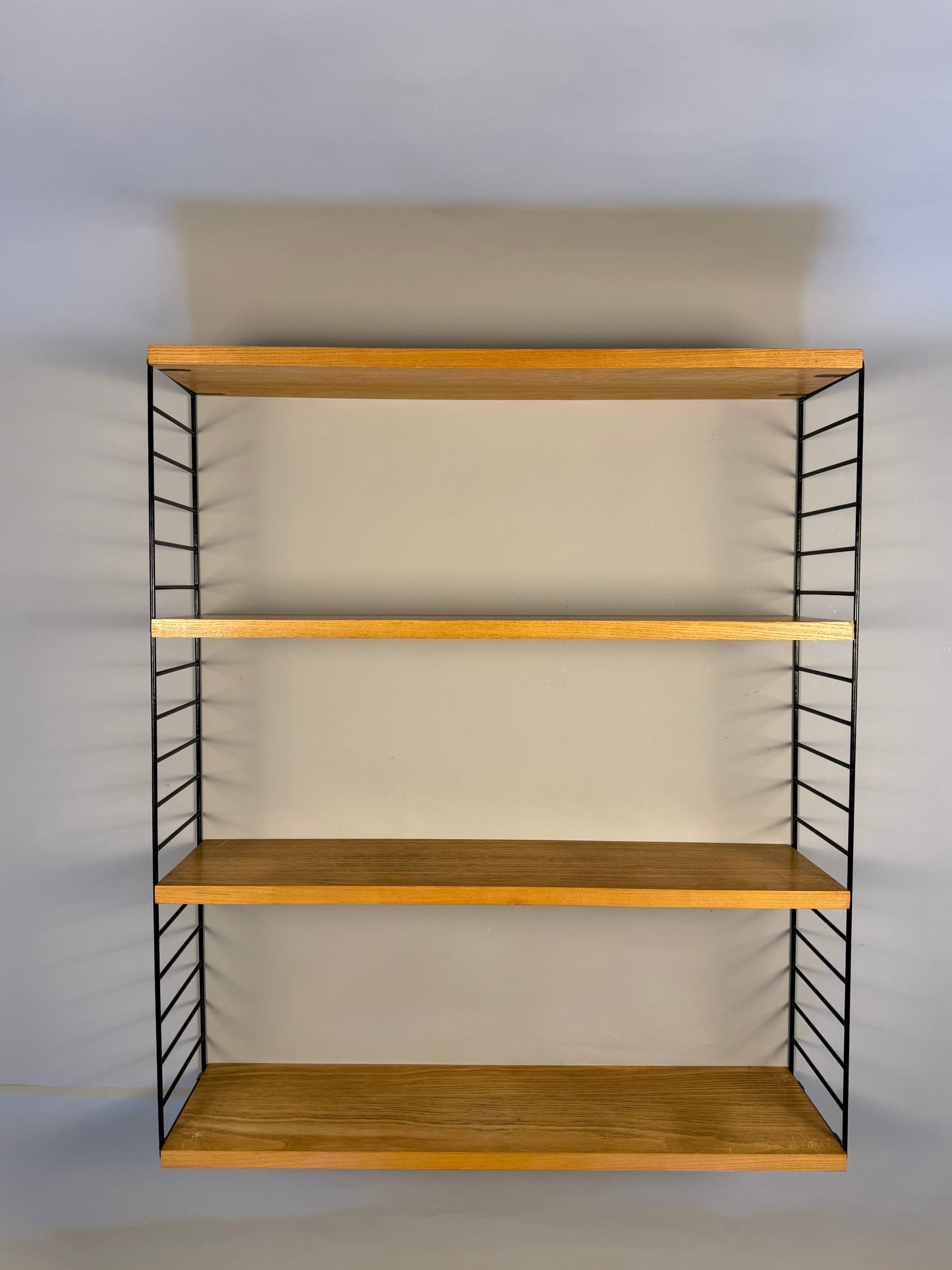 Floating wall shelf in oak veneer and black metal, 1960s